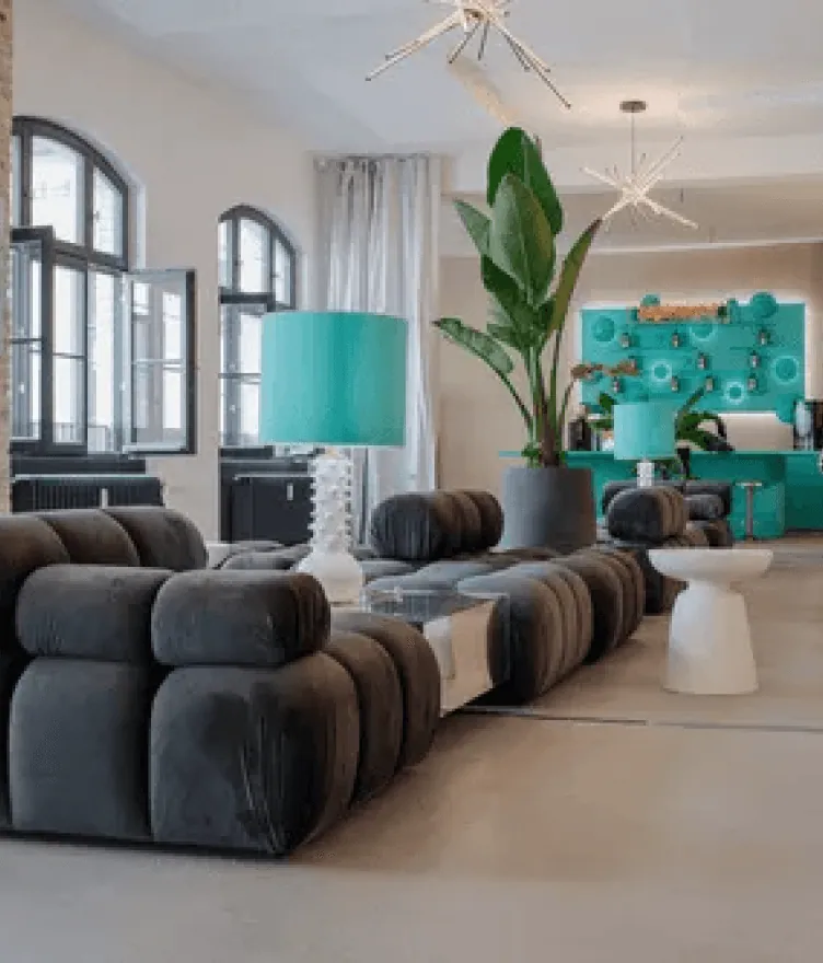Cosy community lounge with plants and modular sofas