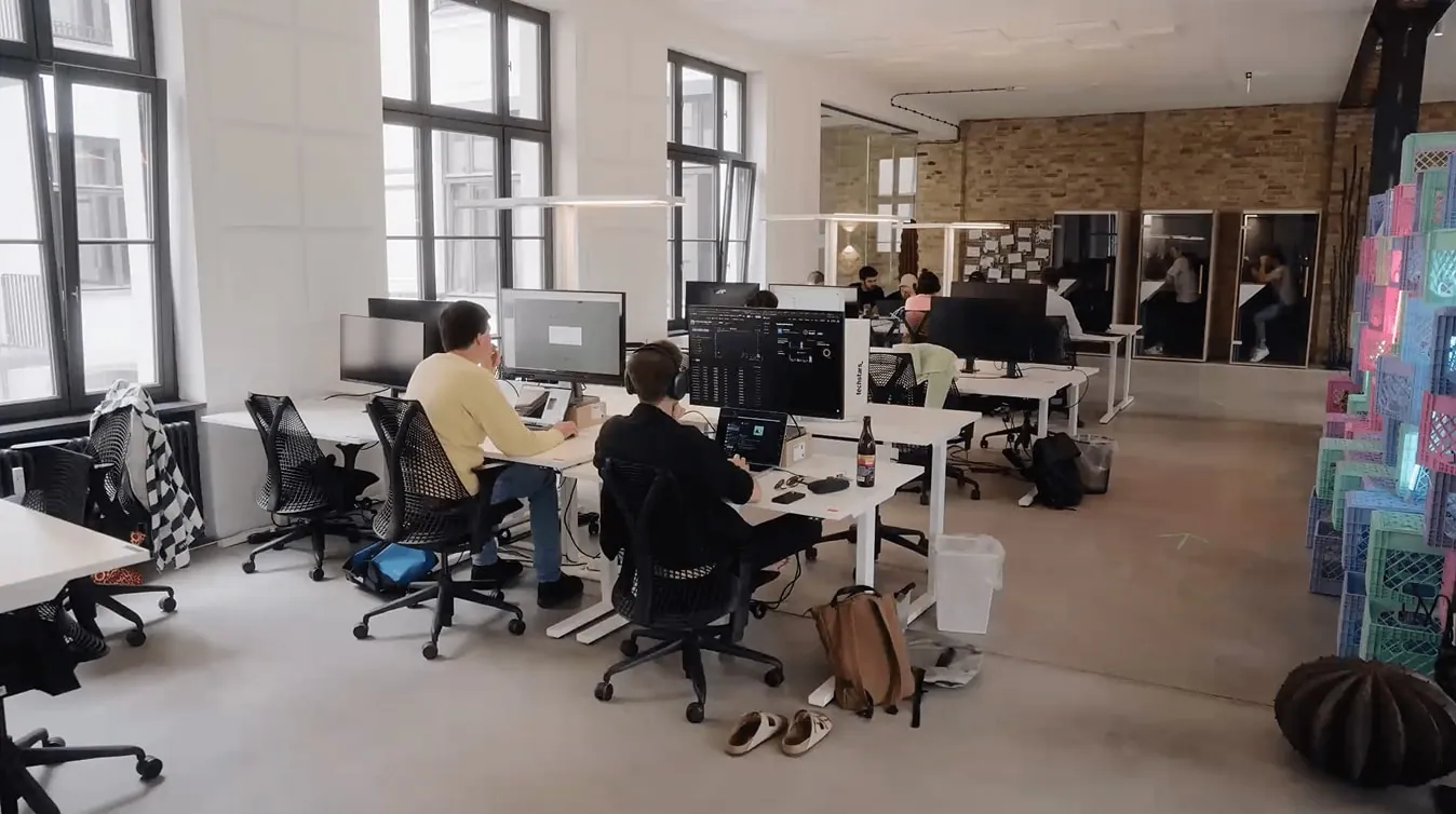 Members working at desks in the w3.hub coworking space in Berlin Kreuzberg